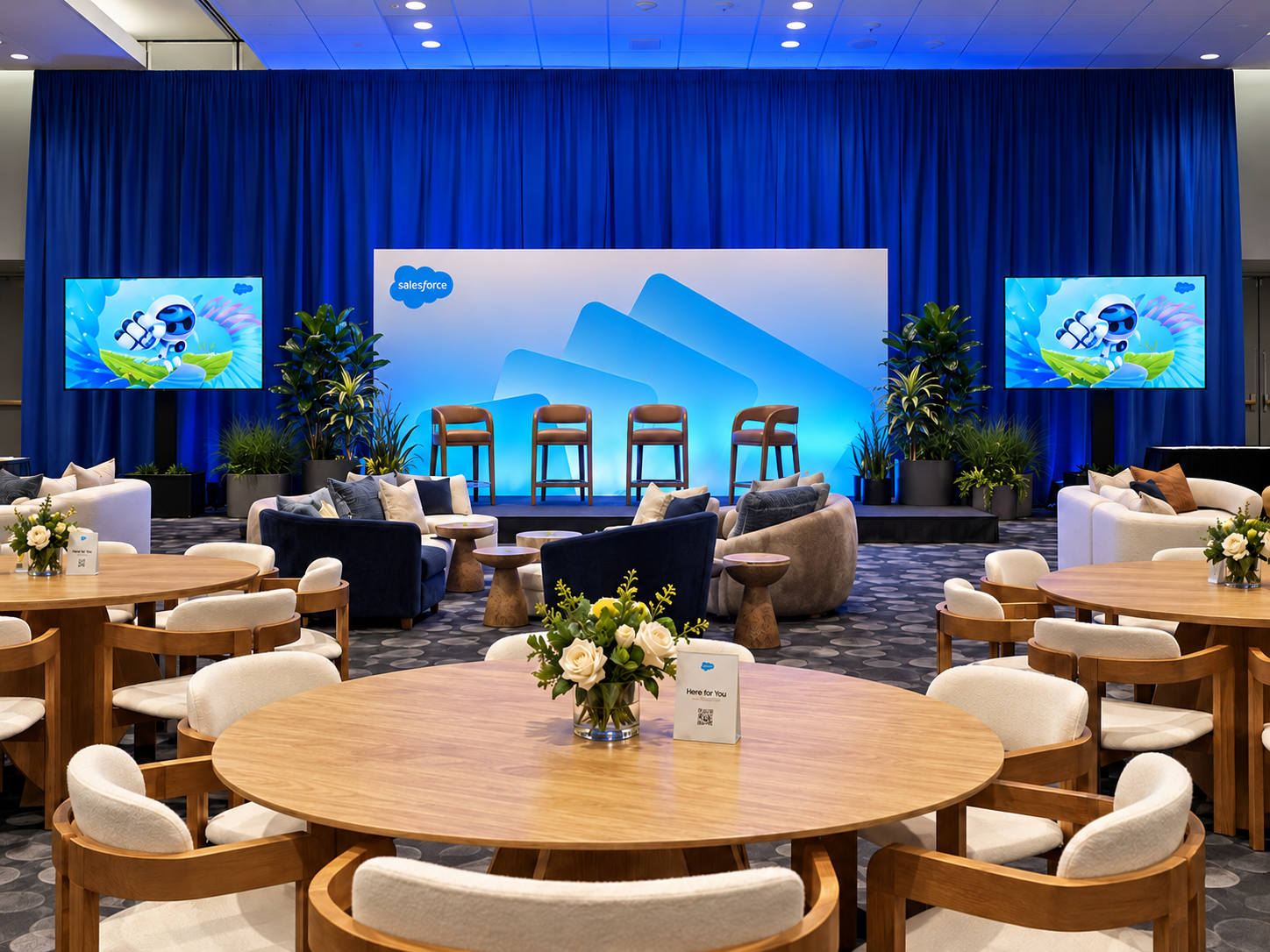 Four blue panels on a stage
